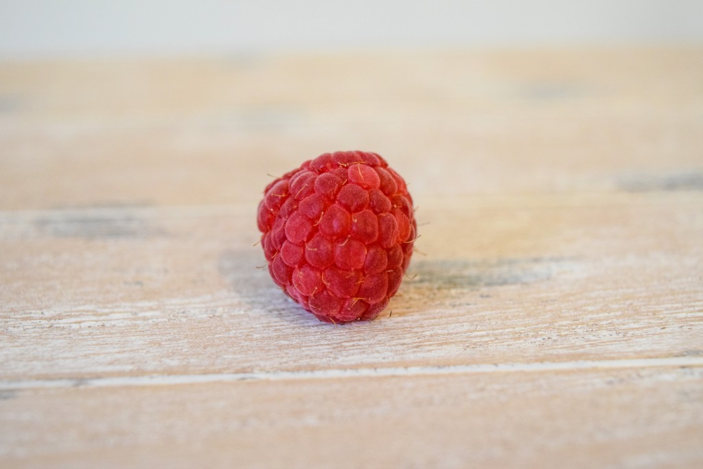 close up of a red raspberry