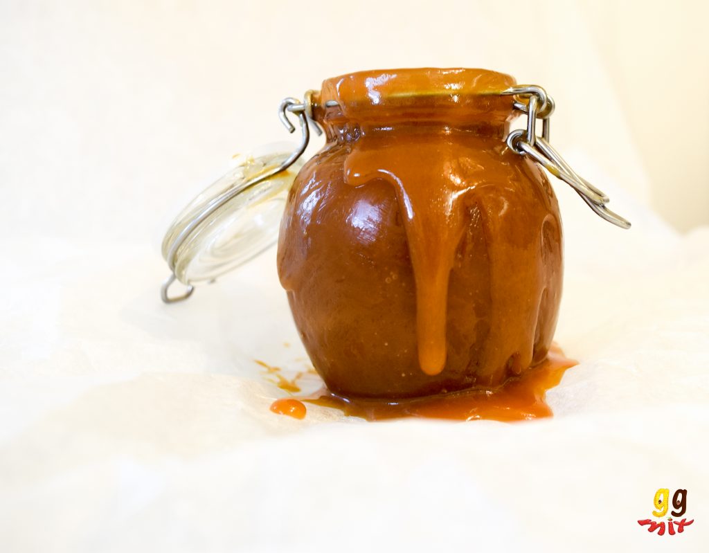 salted caramel sauce in a jar and spilling over