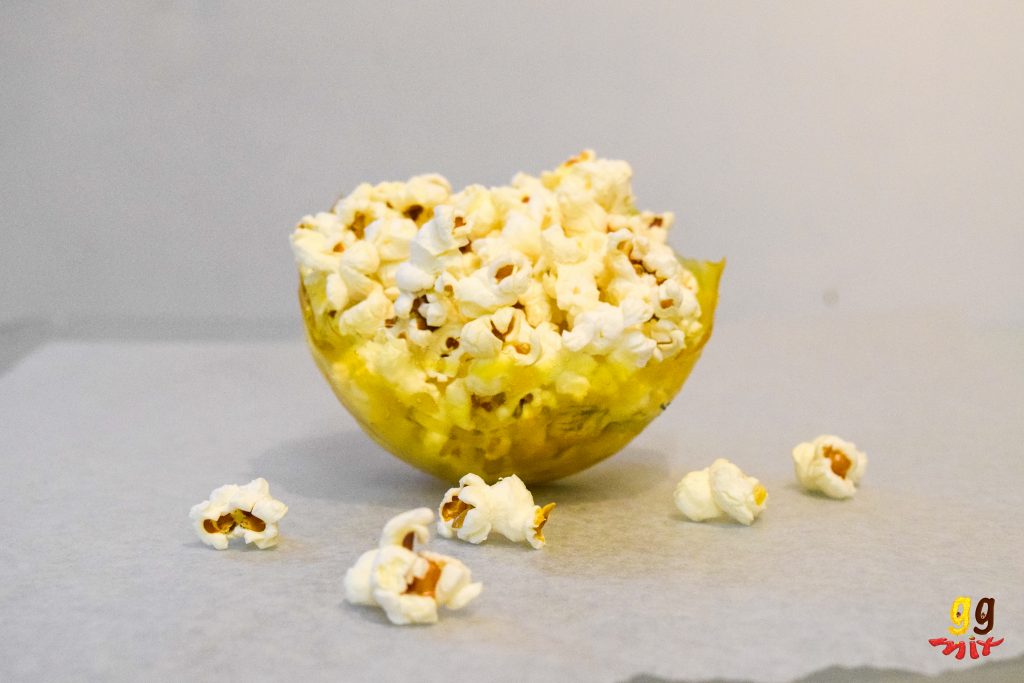 a yellow gelatin bowl filled with popcorn