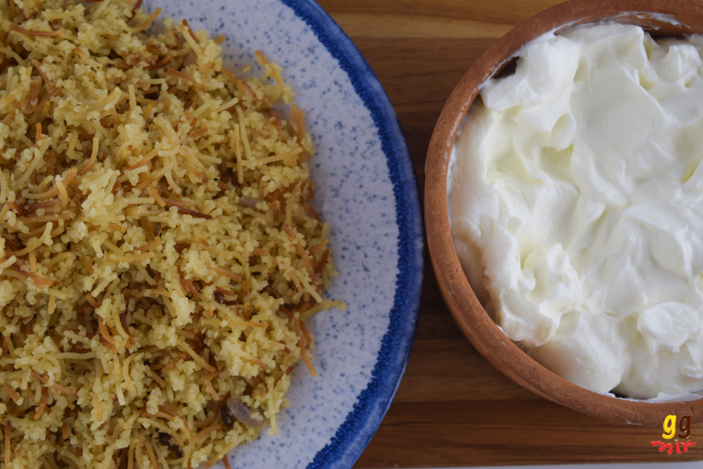 a plate of Greek Cypriot pourgouri and a bowl of Greek yogurt on the side